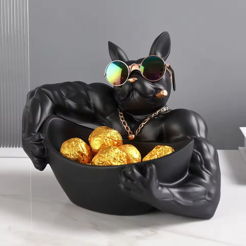 Black dog-shaped bowl with sunglasses and gold balls on a gray background